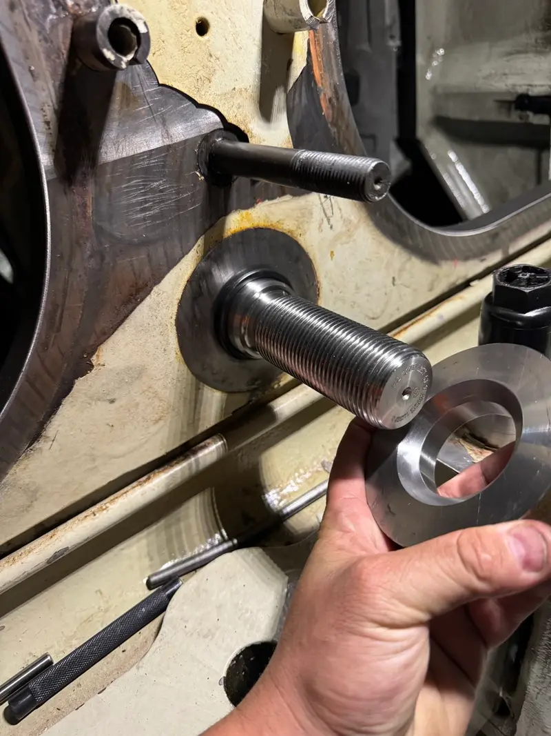 Precision machined bolt and bearing fitting in workshop